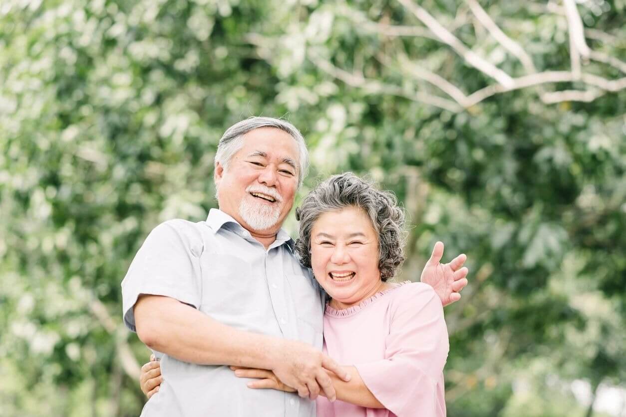 Happy Asian senior couple having a good time.
